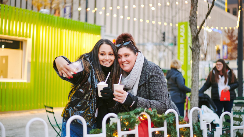 women taking selfie with hot chocolates