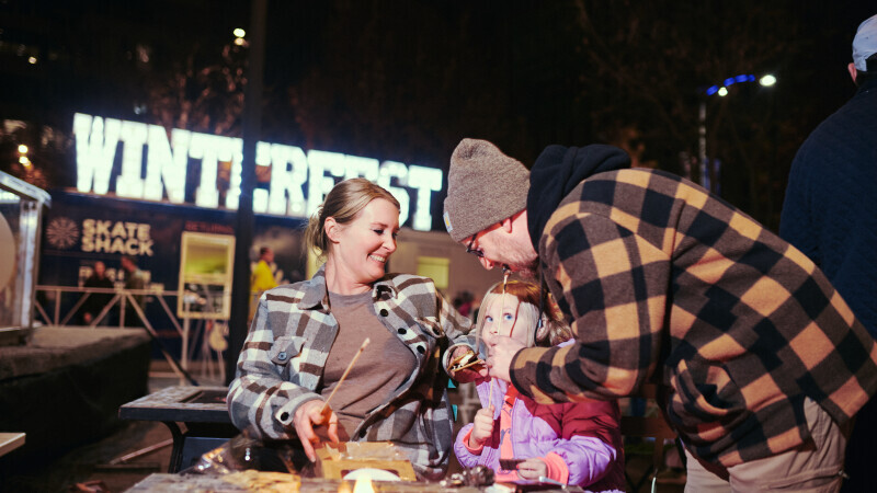 Family Easting S'mores at Winterfest 2025