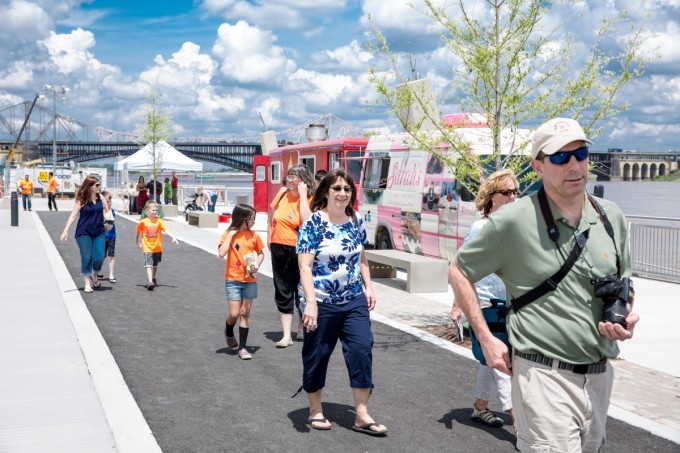 Visitors walk along the riverfront at a Walk to the Wharf event in 2015.
