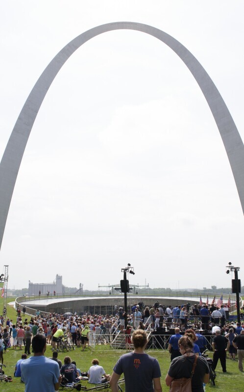 Grand opening day photo of arch and people at opening