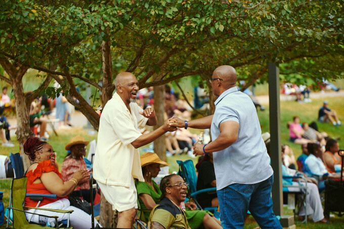 Friends greeting each other at Blues at the Arch